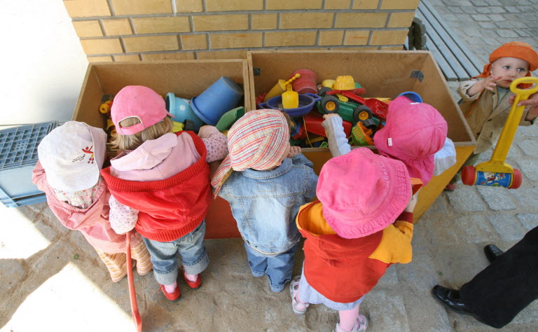 Photo of toddlers in Germany playing in a playground.