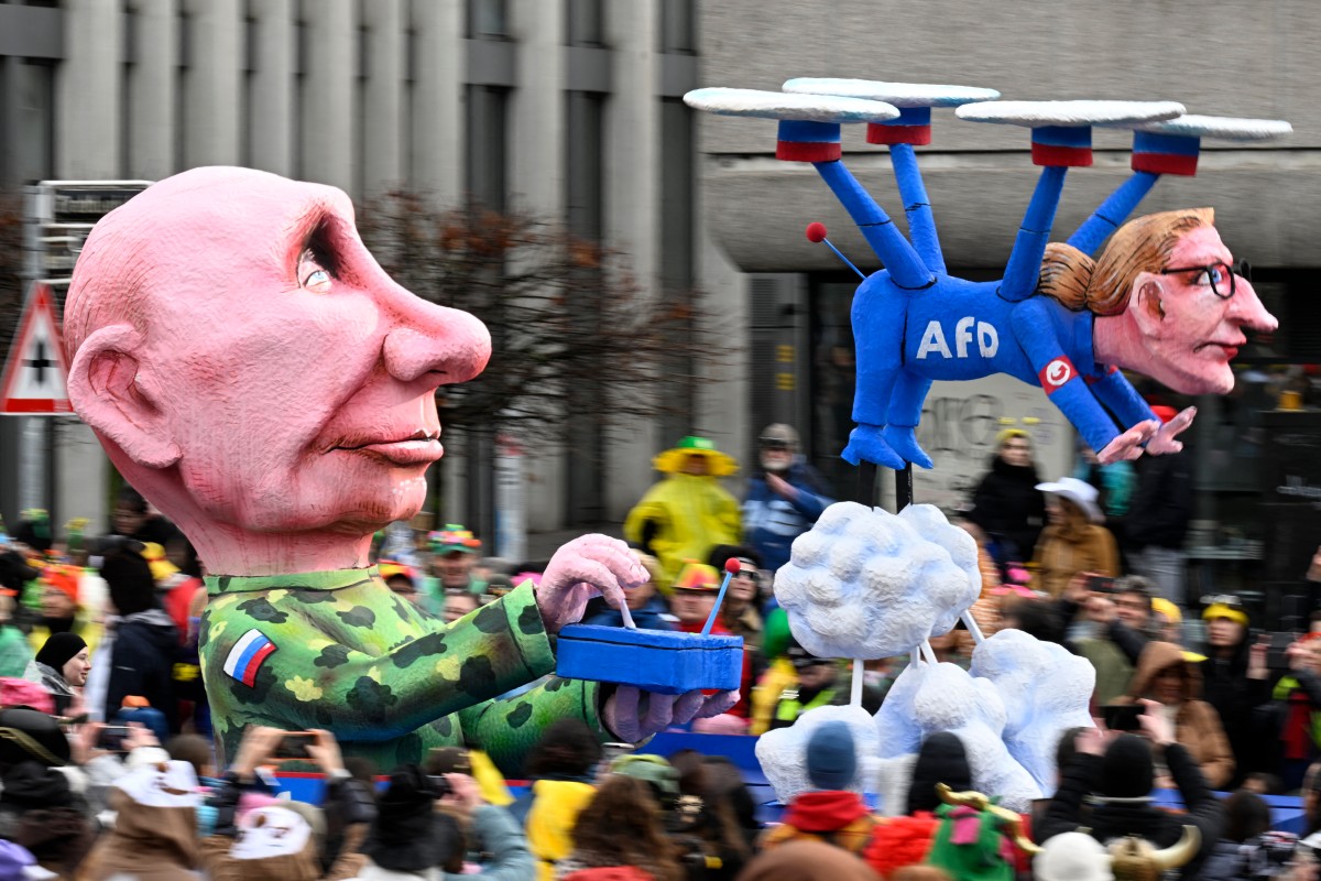 Putin is seen controlling a drone that is carrying the AfD's spokesperson.