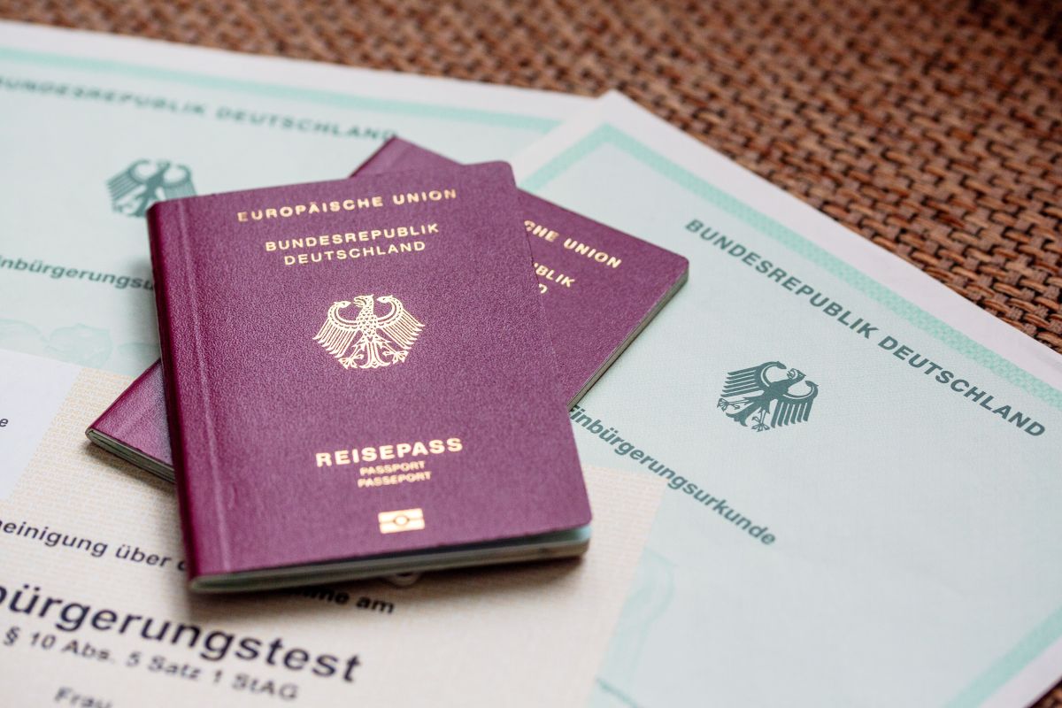 Two German passports on naturalisation certificates.
