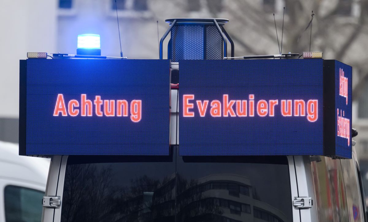A police car drives through the streets during an evacuation of Dresden city center to inform citizens. 
