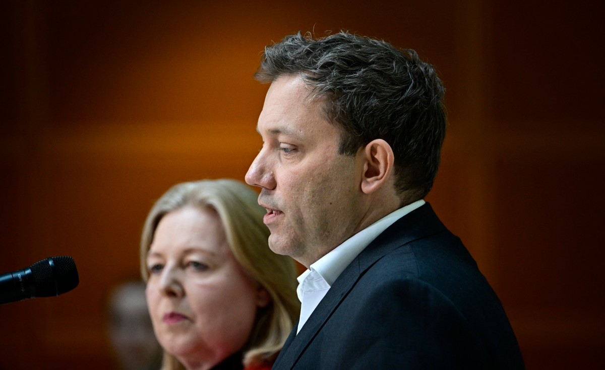 Klingbeil and Bas look solemn as they speak at their p[arty headquarters in Berlin.