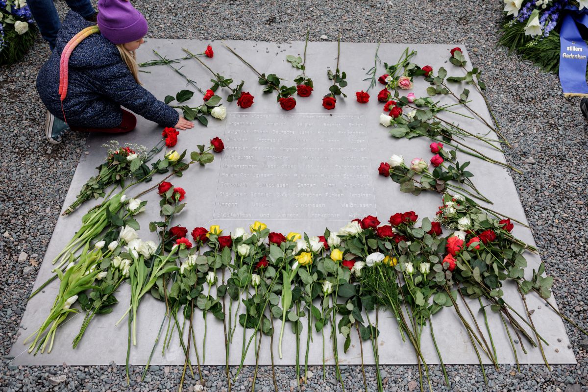 Flowers are placed on a memorial stone during the commemoration ceremony at the memorial site of the former Nazi concentration camp Buchenwald on April 12, 2026