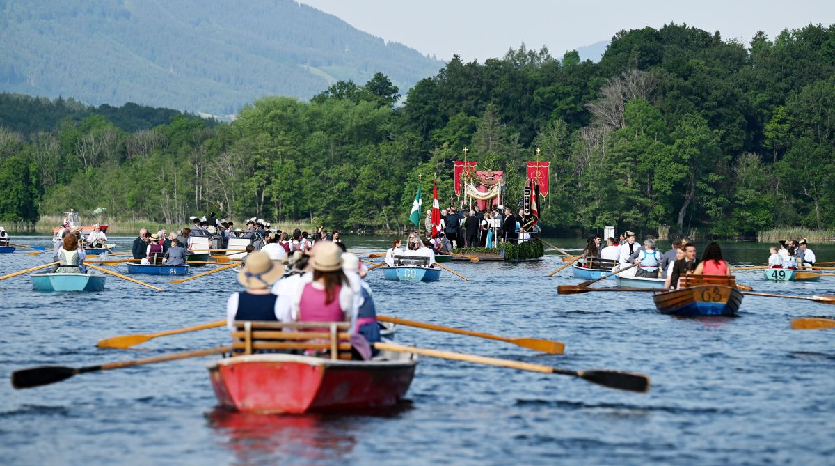 Germans wear traditional dress and paddel on the Staffelsee for a holy procession.