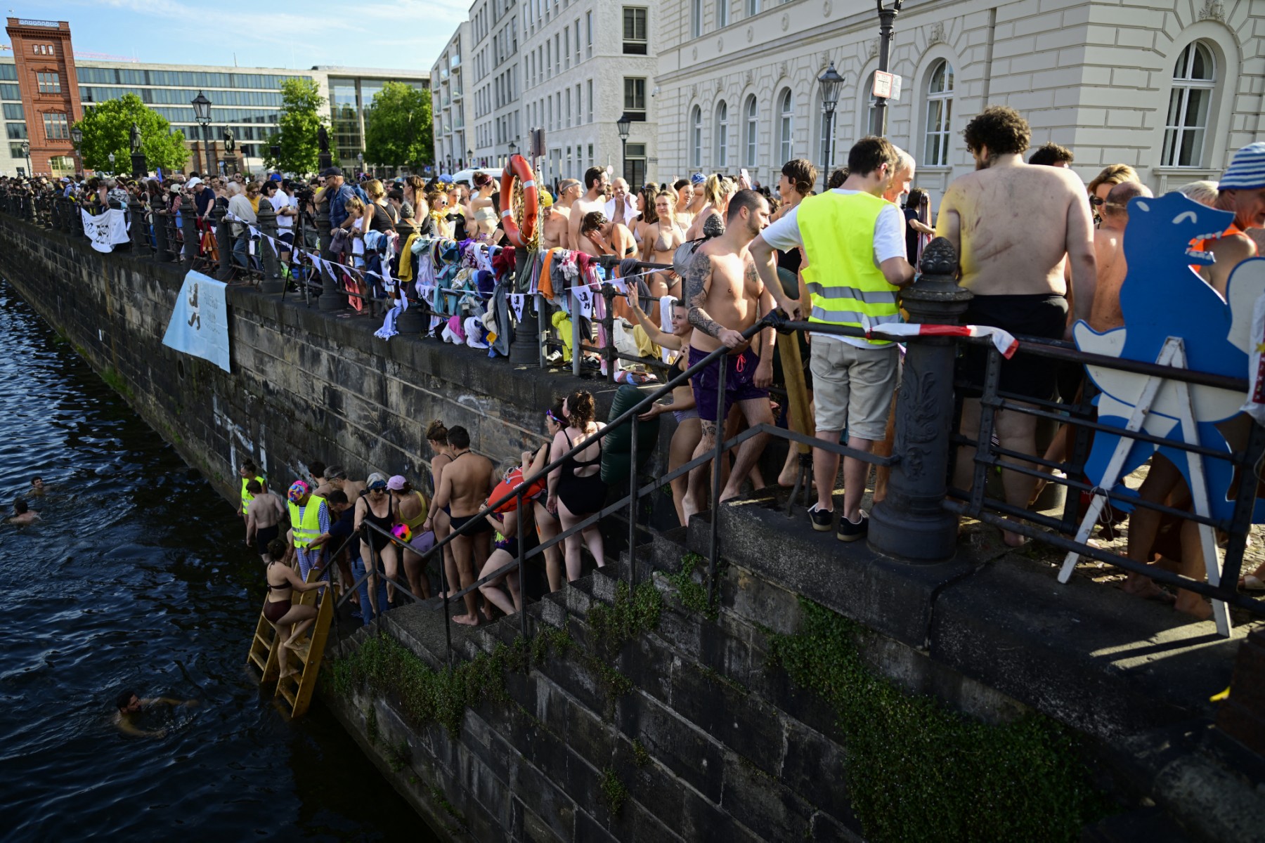 Swimmers line up to take a dip in the Spree river during a demonstration.