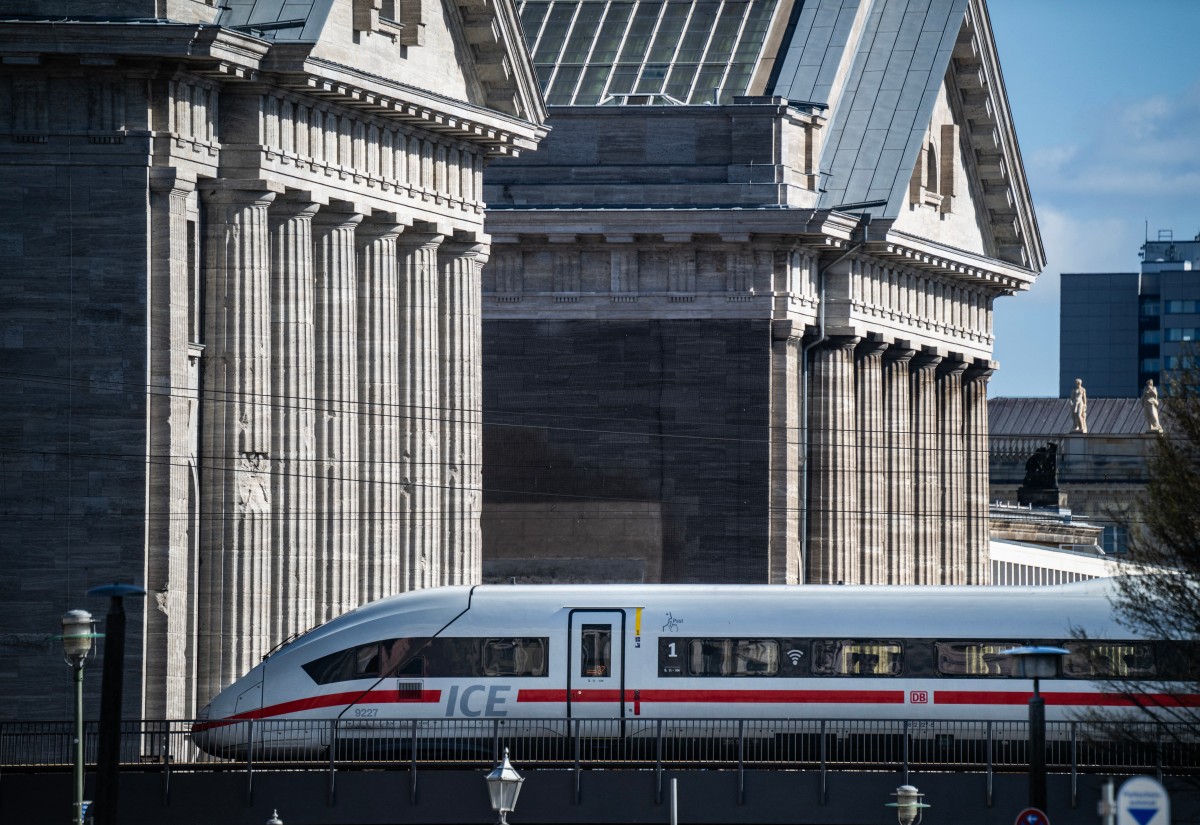 An ICE (Inter-City Express) train travels past the facade of Berlin's Pergamon Museum on April 6, 2026.
