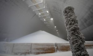 A photo taken on April 9, 2026 shows crystals developed around a pole as a stock pile of granular urea is seen at a storage facilty at the SKW Piesteritz agro-chemical plant in Piesteritz near Wittenberg