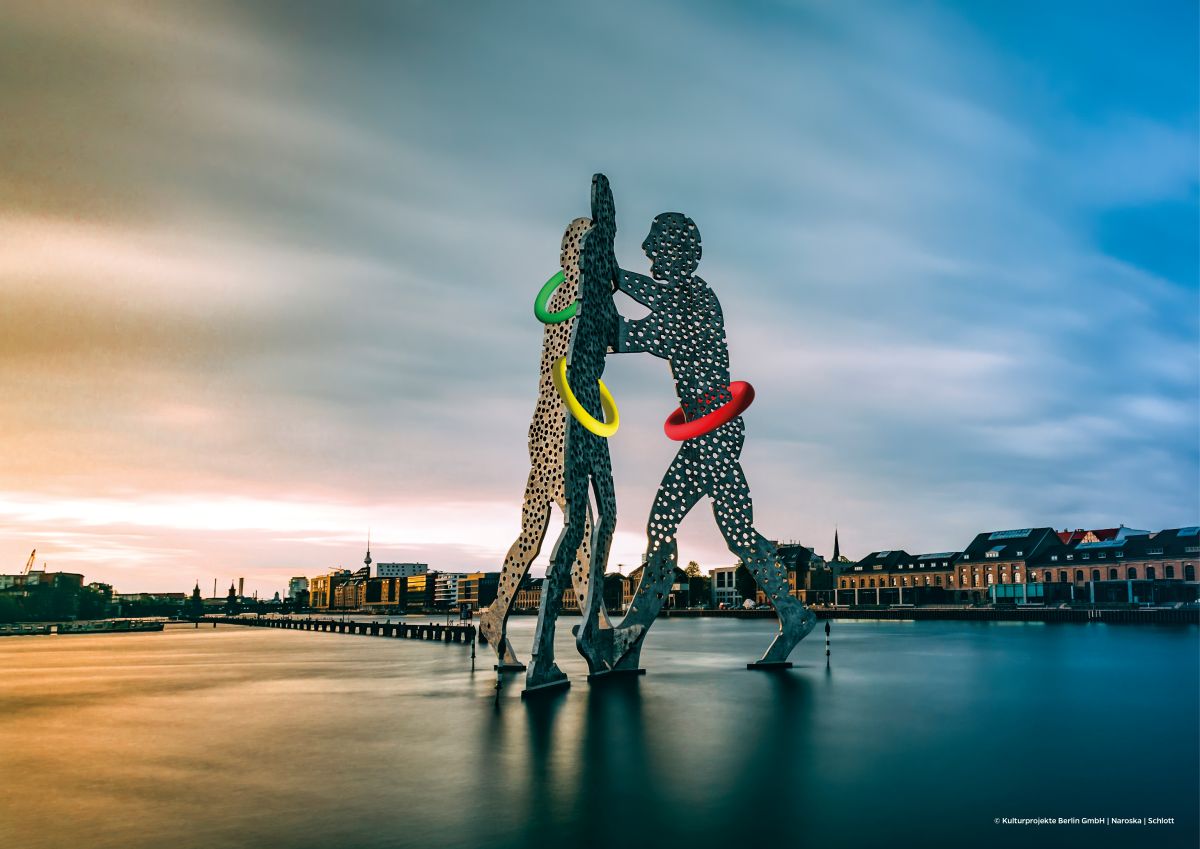 View of Berlin's Molecule Man with Olympic Rings added.