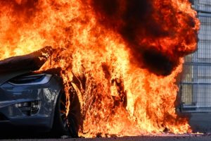 This photograph shows a burning Tesla car during a rally of a "No-G7" coalition of over 60 associations, unions and left-wing groups "against fascism and imperialism, a day ahead of the summit's start, in Geneva