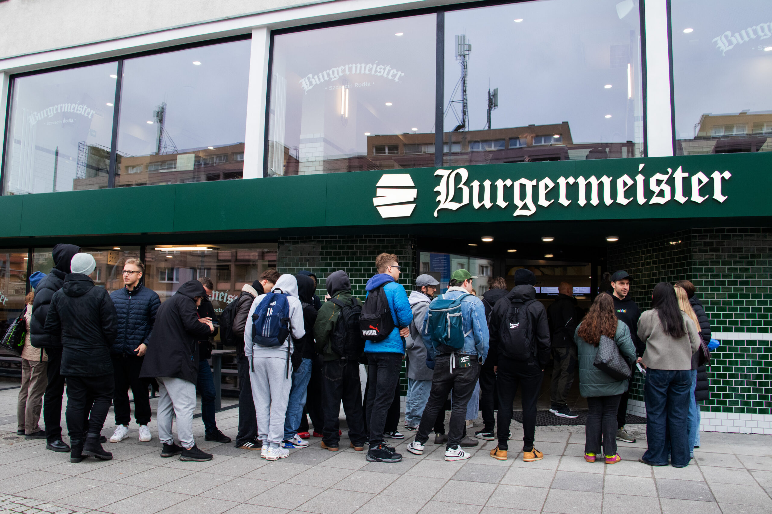 People gather outside a Burgermeister location in Szczecin, Poland.