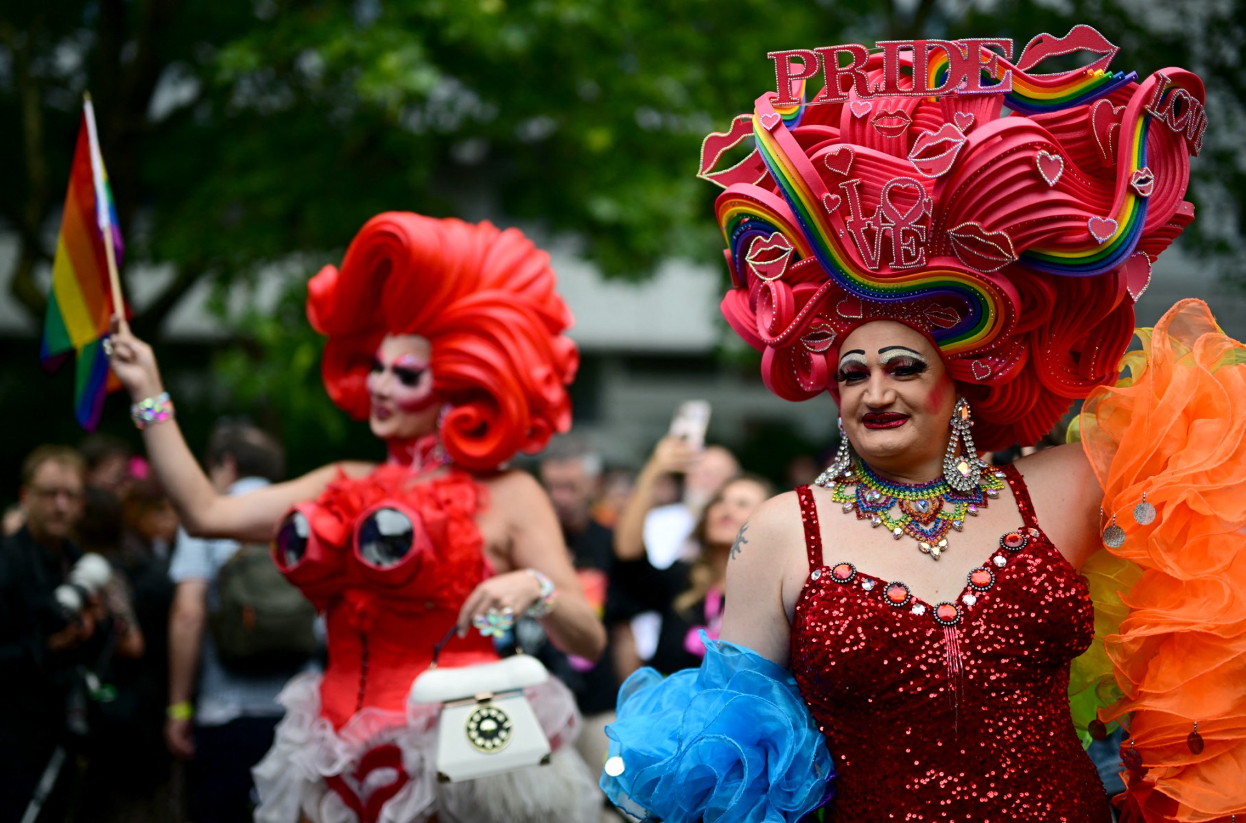 Participants of the Christopher Street Day (CSD) parade cheer as people take to the streets of Berlin 