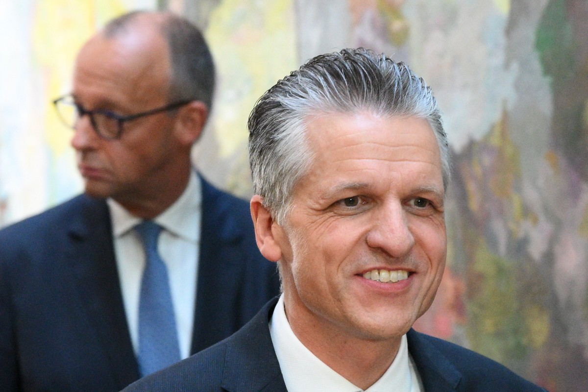 German Chancellor and leader of the Christian Democratic Union (CDU) Friedrich Merz and newly elected parliamentary group leader of Germany's Christian Democratic Union (CDU) Thorsten Frei leave after a press statement.