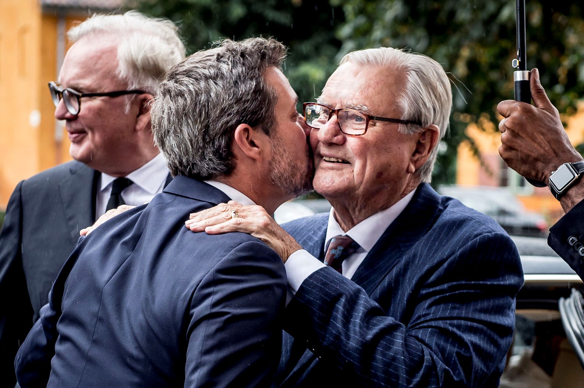 Prince Henrik being greeted by his son, Frederik