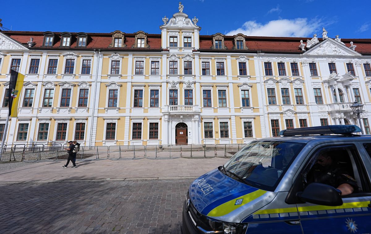 A police van stands in front of the government building in Saxony-Anhalt