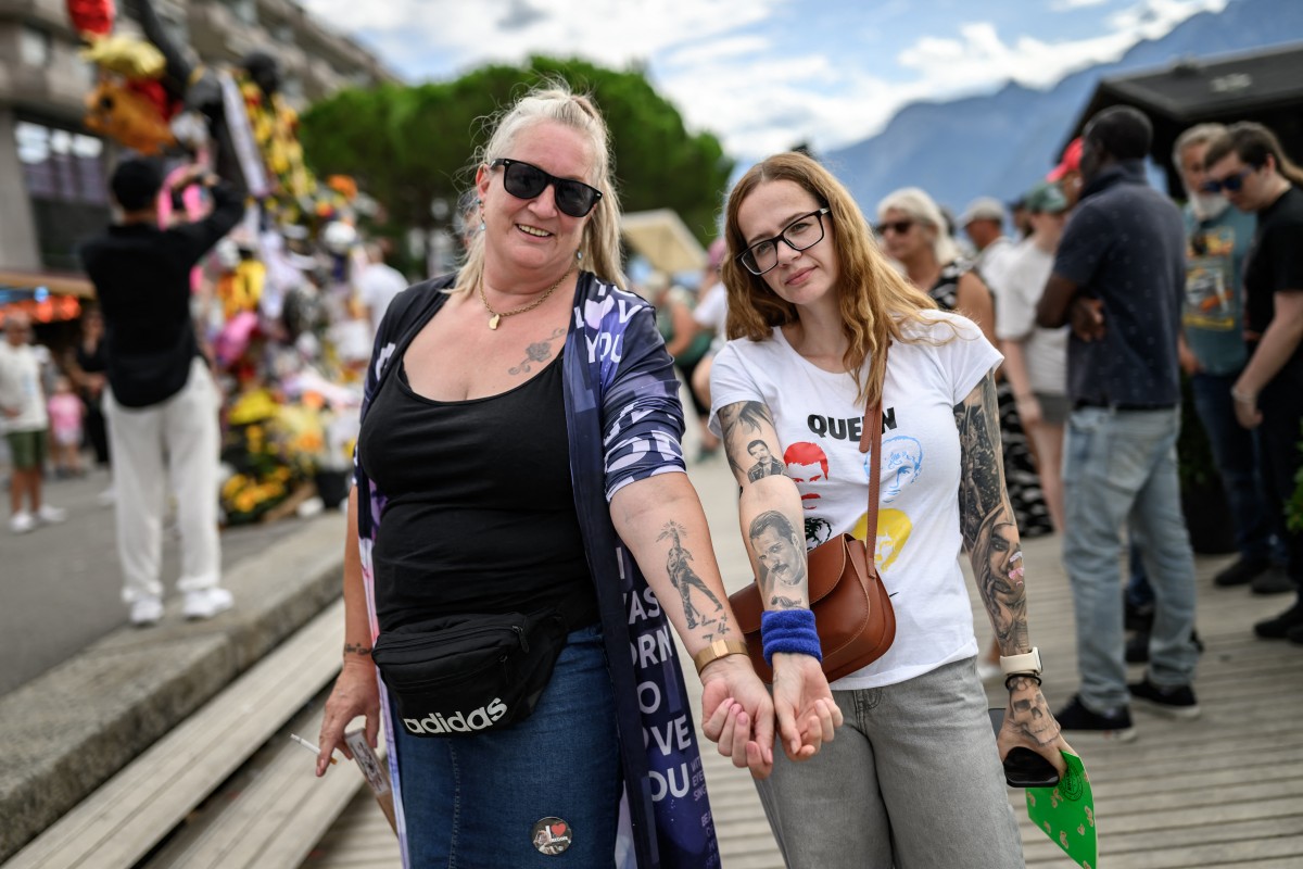 Fans show their tattoos during Montreux Freddie Day, marking the 80th anniversary of the birth of Freddie Mercury, the Queen frontman, in Montreux, Switzerland