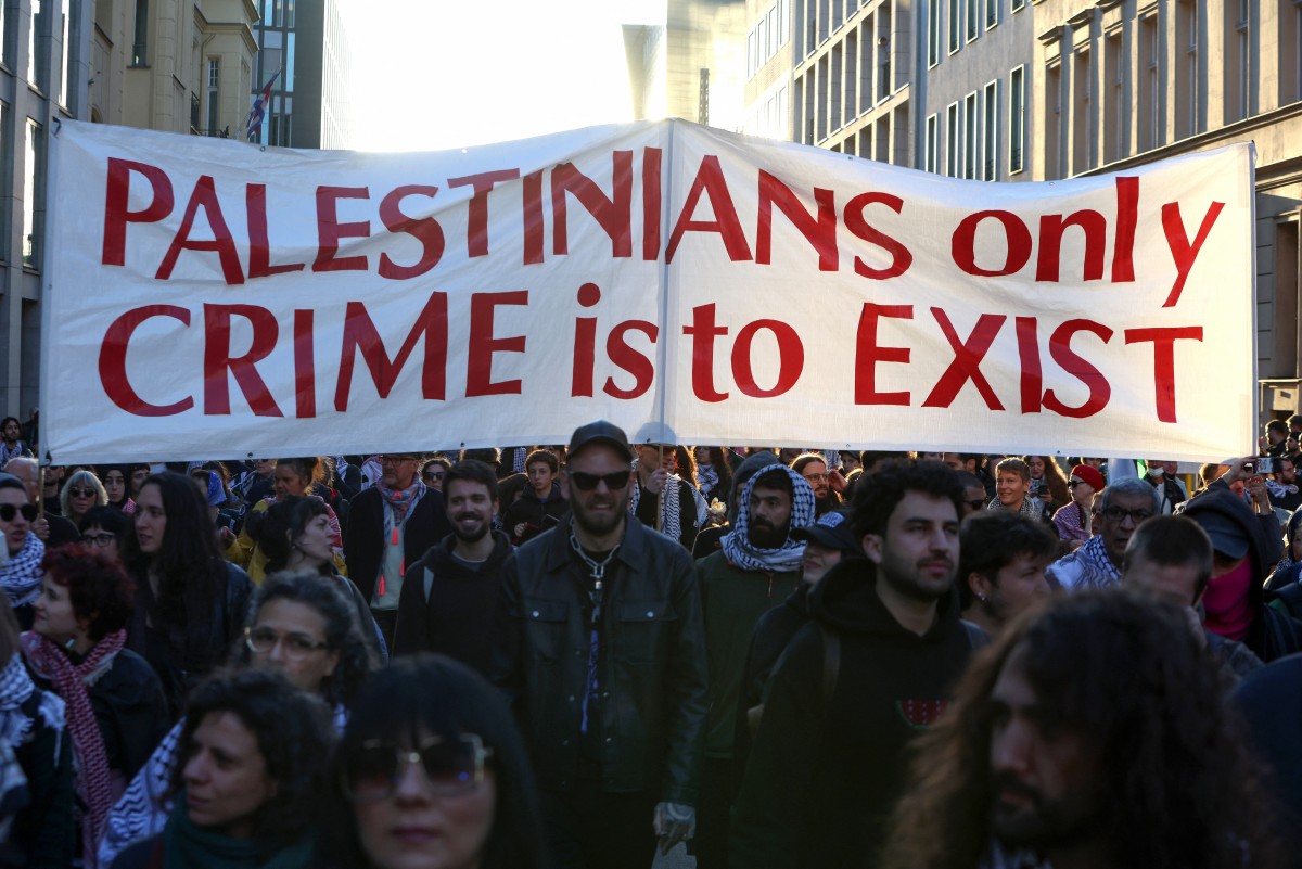 Protesters holds a banner during a pro-Palestinian demonstration under the title 'United4Palestine' in Berlin